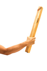 Hand holding a wooden thick stick.