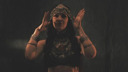 Sensual woman dancing in light and shadow