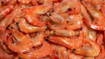 Shrimps background texture. A lot of shrimps. Cooked shrimps.