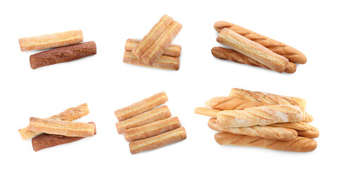 Set with freshly baked tasty baguettes on white background, top view. Banner design