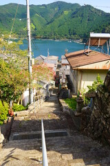 Stairs and Aerial view of Fisherman's village, Traditional Japanese town of Sugari-cho, in Mie, Japan - 三重県 尾鷲市 須賀利町の街並み