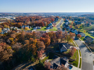 Aerial view of Eau Claire, Wisconsin, residential neighborhood in autumn.  Wide streets with curbs...