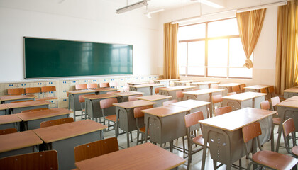 Fototapeta Empty classroom with chairs, desks and chalkboard. obraz