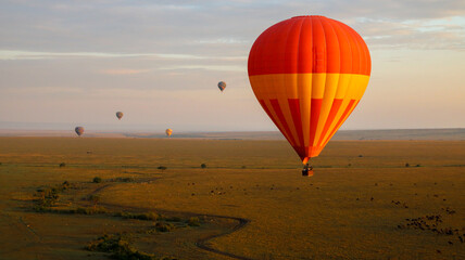 hot air balloon at sunrise.Masai mara, savana Kenya. Balloon Trip