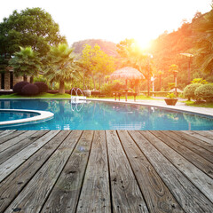 Wood platform beside swimming pool.
