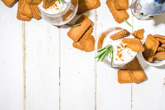 Biscoff coffee latte with cookie pasta, whole cookies, whipped cream and rosemary decor 