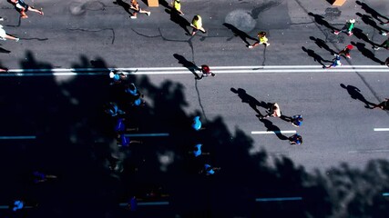 Marathon running on street. 4K Aerial drone fooage. Top view