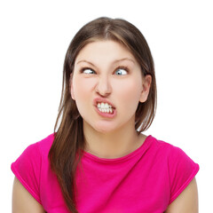 Teenage girl grimacing,girl making funny grimaces by clenching her teeth - obrazy, fototapety, plakaty