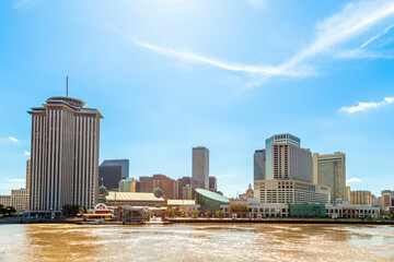New Orleans city panorama from Mississippi River with business district skyscrappers and river promenade, Louisiana, USA