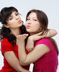 Happy friends  hugging each other.Teenage girl using smart phone.Selfie.Girl have fun .