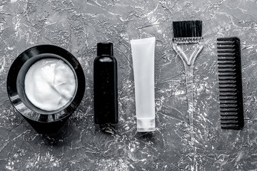 Tools for hair dye in barbershop on gray background top view