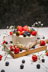 Beautiful strawberry cake decorated with strawberries and blueberries