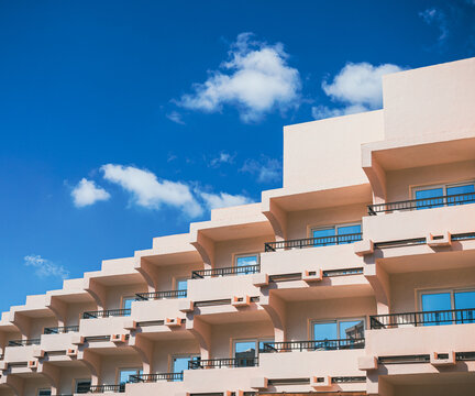 Apartment building with the sky reflected in its windows 