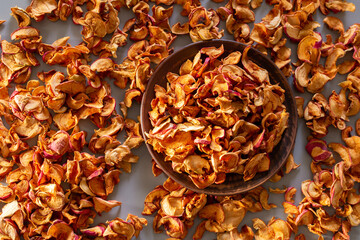 a lot of a plate of dried apples, chopped. top view, flat lay