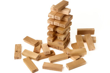 Jenga Tower is a board game made from wooden blocks. Home entertainment. On white background
