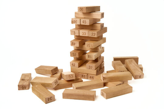 Jenga Tower is a board game made from wooden blocks. Home entertainment. On white background