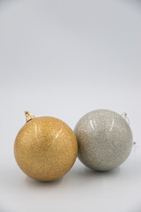 Yellow and white christmas balls isolated on a white background.