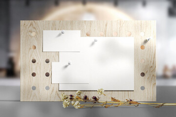 Clean minimal business card and flyer mockup on wooden board with dry leaves in cafe