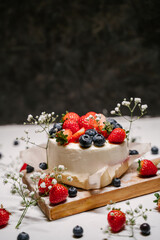 Beautiful strawberry cake decorated with strawberries and blueberries