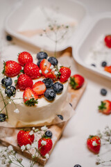 Bento cake with berries in a white package - container
