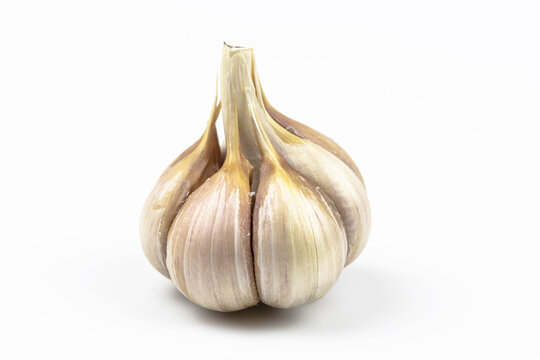 Head of garlic by close up  isolated on a white background.