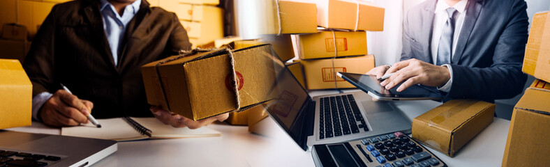 Online sales ideas for work at home. Asian man is answering phone calls. To accept orders from...