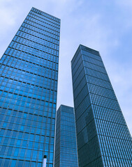 "silent giants": a slanted view of three modern office buildings in a cluster