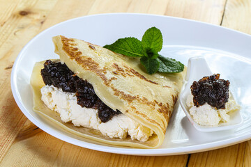Pancake with cottage cheese and jam