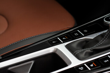 Close up view of modern car electronic safety systems control panel. Modern car interior detail.