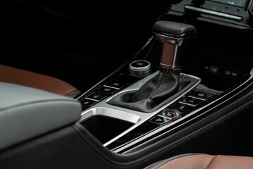 Modern automatic gearbox. Close up of the gearbox transmission handle. Automatic gear stick.