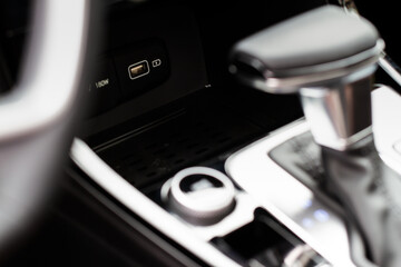 Wireless mobile charger in the modern car. Portable wireless car charger for smartphone.