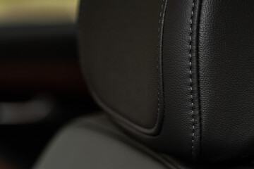 High angle view of modern car fabric seats. Close-up car seat texture and interior details. Detailed image of a car pleats stitch work.