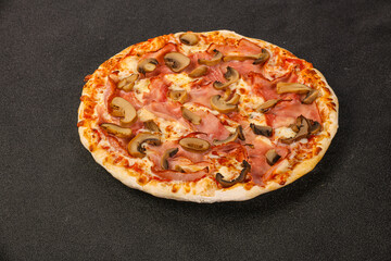 Pizza with ham, cheese and mushrooms