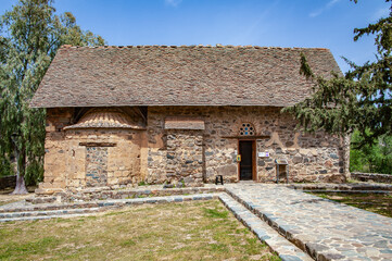 Fototapeta na wymiar To protect the Church of Panagia Asinu from the Turks, as elsewhere in Troodos, an upper gable roof was used. The domes and arches of the church itself and the narthex are hidden under it. 