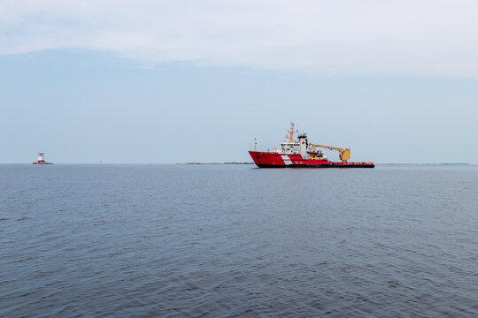 Carling, Ontario, Canada - 07-17-21: Samuel Risley Canadian Coast Guard ship anchored at Red Rock on Georgian Bay for maintance on the light house