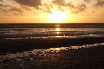 Sunset over Sahlenburg beach and the wadden seas on a spring evening, Sahlenburg, Cuxhaven, Lower Saxony, Germany
