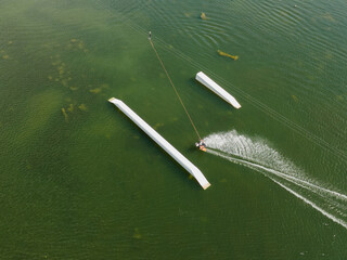 Aerial view of man wakeboarding on the lake