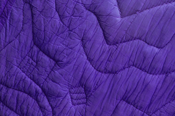 violet large bedspread. blue unusual texture. magenta rippled background. purple embossed surface
