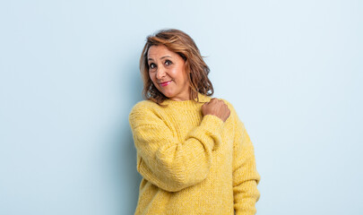 middle age woman feeling happy, positive and successful, motivated when facing a challenge or celebrating good results