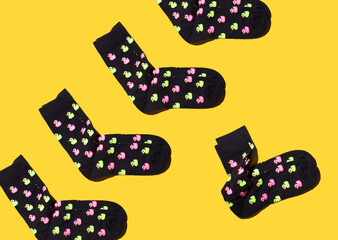 funny bright socks on a yellow background. pattern