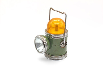 Vintage metal green flashlight, isolated on a white background