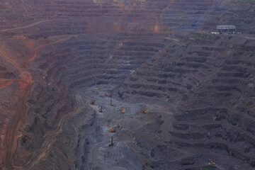 The horizons of a large iron ore quarry. Heavy mining industry. Open-pit mining of poor iron ores, the initial stage of metallurgical production
