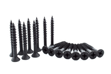 Pin or screw for drywall, chipboard or plaster, black, flat head for cross screwdriver, on a white...