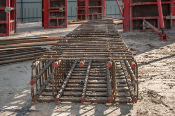 The reinforcement frame of the column lies on the concrete.