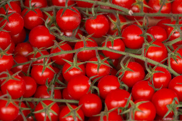 Plenty of cherry tomatoes in a box on a market