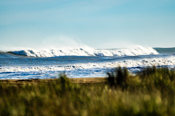 Large waves on the beach of Ebro delta in Spain on a sunny day