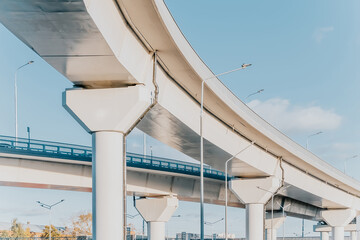 Automobile overpass on concrete supports. New road infrastructure. Preventing traffic jams
