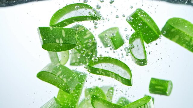 Super slow motion of splashing aloe vera into water. Filmed on high speed cinematic camera at 1000 fps.