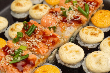 Japanese dish of sushi or rolls close-up.