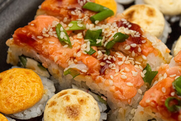 Japanese dish of sushi or rolls close-up.